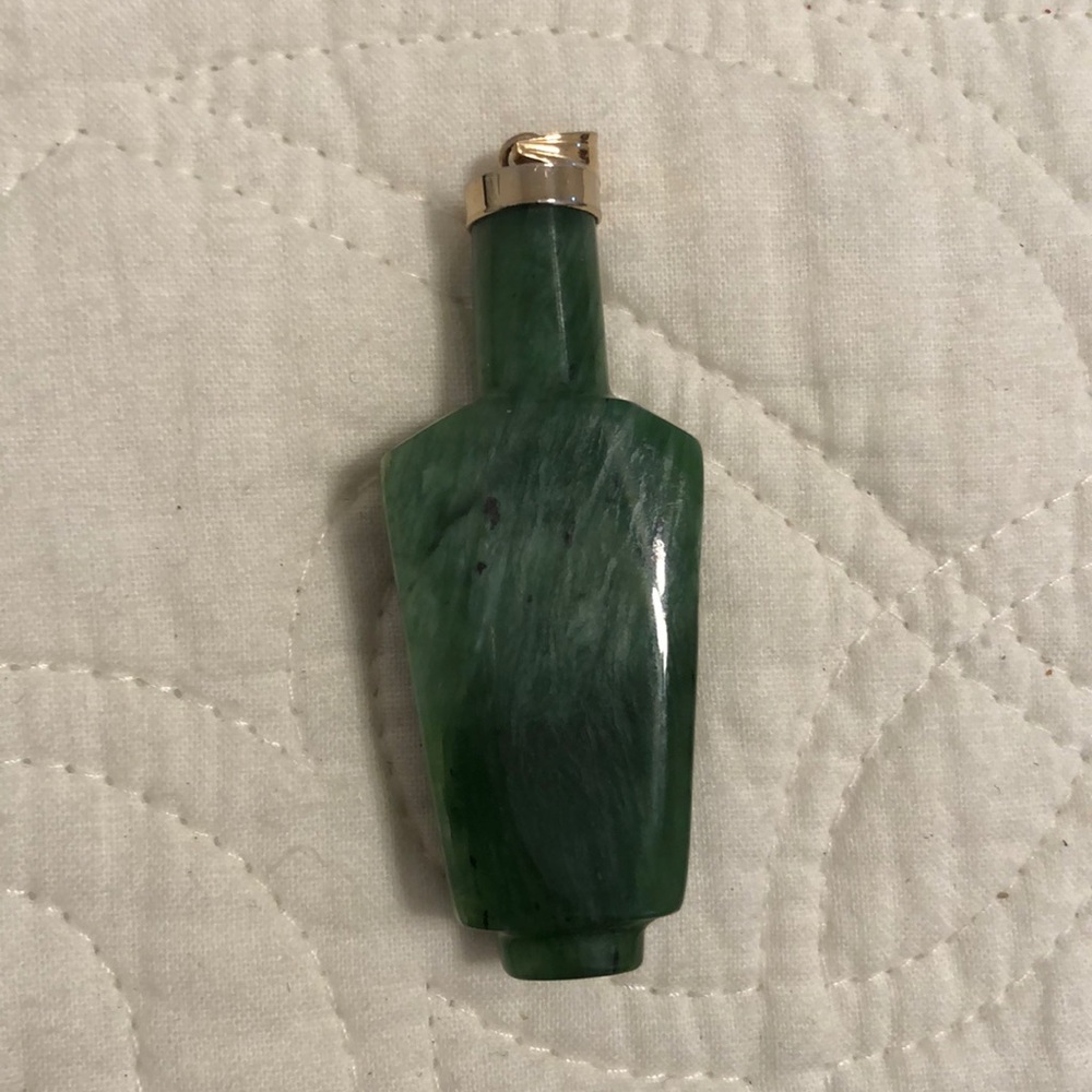Jade and gold pendant.